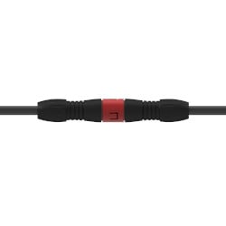 A side view of a black and red nylon SFS three-socket break-away safety feature connector on a black CTC industrial cable.