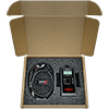 A TM1223 accelerometer verification meter and 3 cordsets secured in a black foam insert in a brown cardboard shipping box.