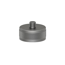 A circular MH103-1B stainless steel accelerometer mounting magnet with a flat bottom, knurled ring around the perimeter, and a mounting stud extending out of the center of the top.