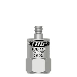 A small, top exit TMP Line vibration analysis sensor engraved with the TCB110 part number and other identifying product information.