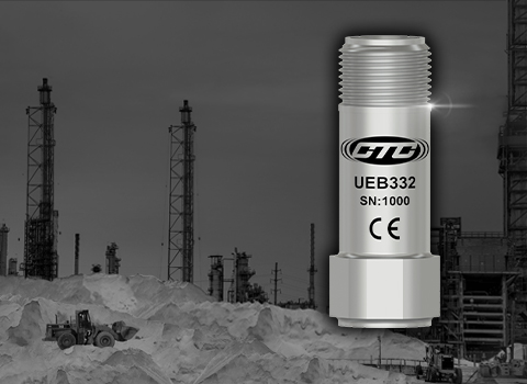 rendering of miniature UEB332 ultrasound accelerometer in front of industrial background