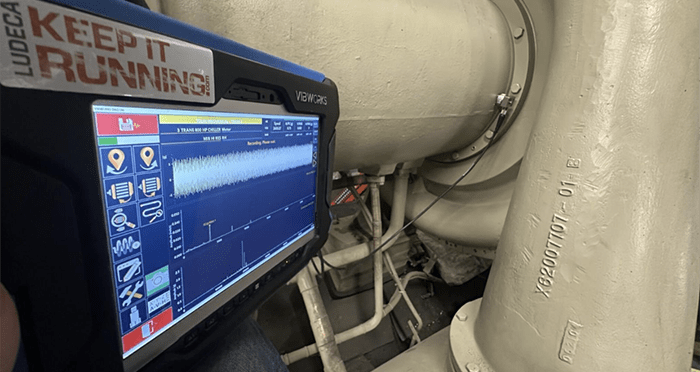 Photo of a Betavib data collector and CTC TREA330 accelerometer mounted on a machine.