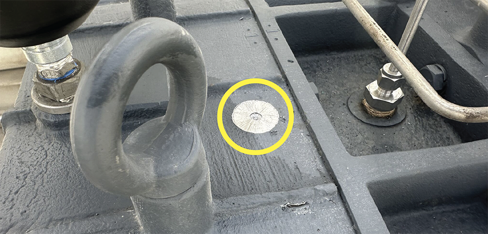 A photo showing the surface of a machine that has been spot faced for adhesive mounting.