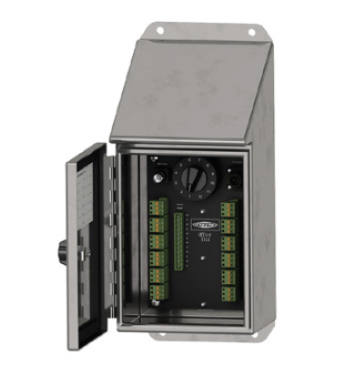 stainless steel switch box with open front panel showing the interior black panel with green T-plugs