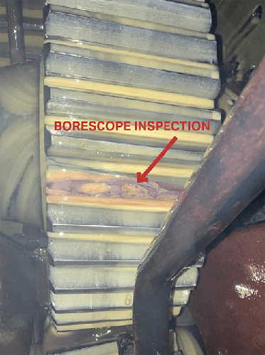 A photograph of a damaged gearbox.