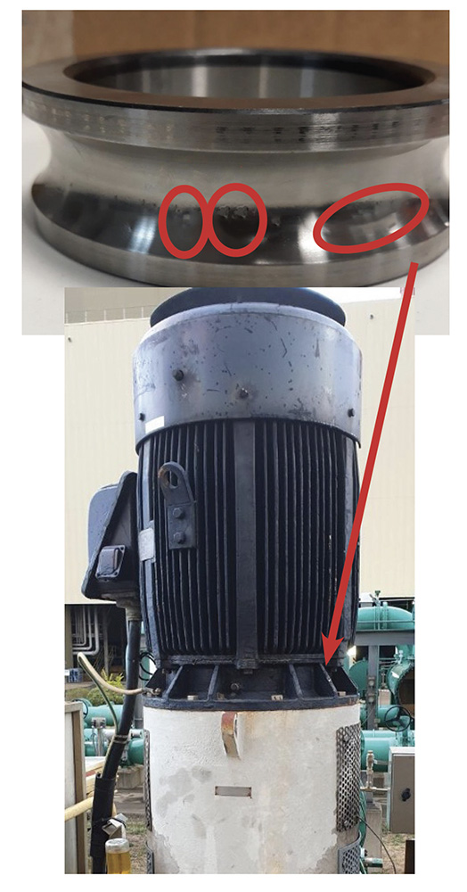 Photograph of close up of outer race bearing defects and the motor it is from