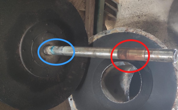 A photograph of wear caused by runout on a rotating shaft.