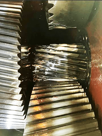 A photo showing the damage to the gearbox is consistent with the vibration data collected.